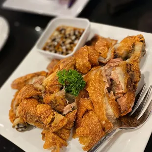 Crispy Pata: tender chunks of meat and crispy skin. Highly recommend ordering with Kare Kare, flavors go so well together