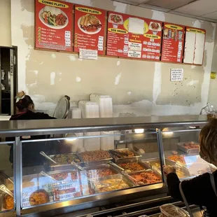 a woman ordering food at a restaurant