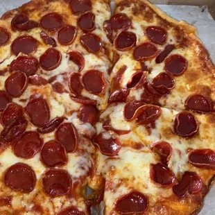 a pepperoni pizza in a box