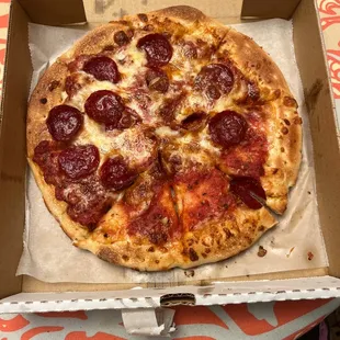 a pepperoni pizza in a box