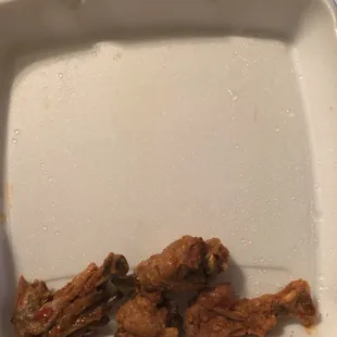 chicken wings in a styrofoam container