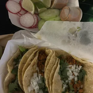 a variety of tacos in a basket