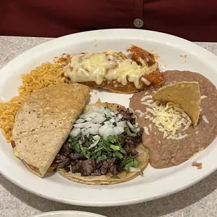 Combination platter, including enchiladas, steak taco, and quesadilla