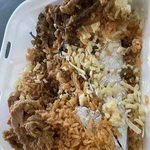 a tray of rice and meat