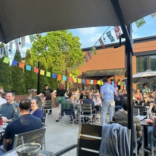 a crowd of people sitting at tables