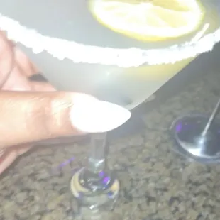 a hand holding a margarita