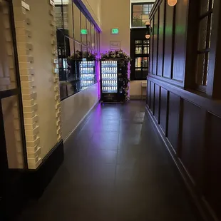 a long hallway with a vending machine