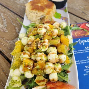 Delicious crab cake appetizer with peach Caprese