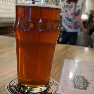 a pint of beer on a table