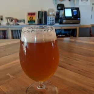 a glass of beer on a table
