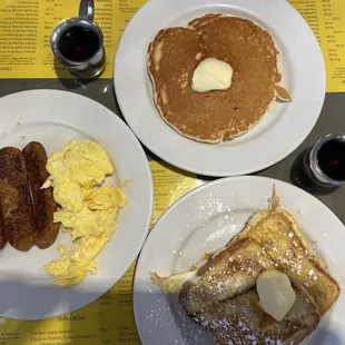 pancakes, sausages, and eggs on a table