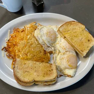 My 3 eggs hash Browns perfectly cooked with sour dough toast. Coffee too with free refills.
