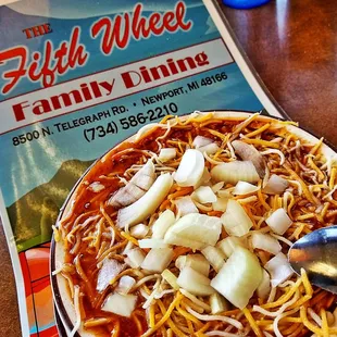 a plate of spaghetti and onions