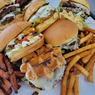 a plate of burgers and french fries