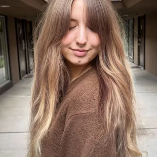 Curtain bangs with a long blended layer cut by Claudia