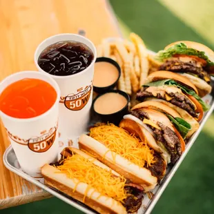 a tray of burgers and fries