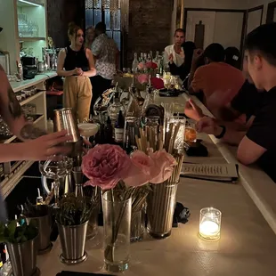 a group of people sitting at a bar
