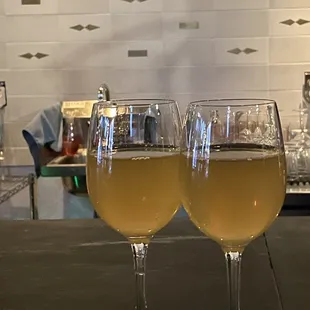 two glasses of wine on a table