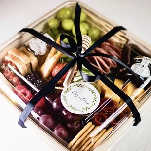 a tray of fruit and cheese