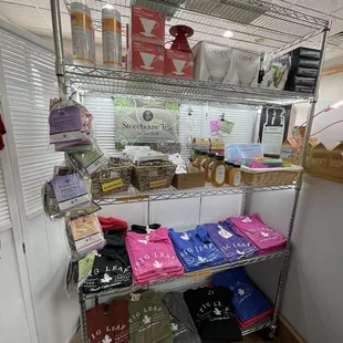 a shelf of t - shirts