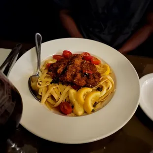 a plate of pasta and meatballs
