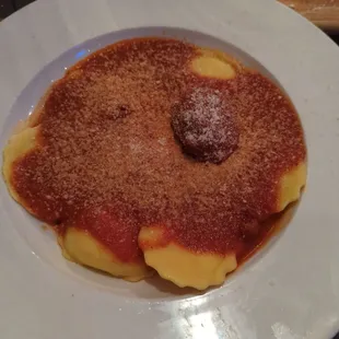 Homemade cheese ravioli with a meat ball