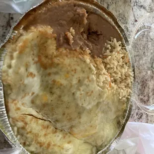 Verde wet pork burrito with rice and beans