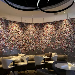 Main dining area with walls of feminist campaign pins.