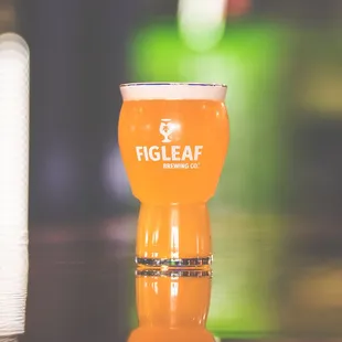 a glass of beer on a table