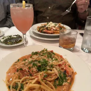 Foreground: Tipsy Chicken Pasta and Citron Lemondate.  Background: Blackened Chicken Pasta
