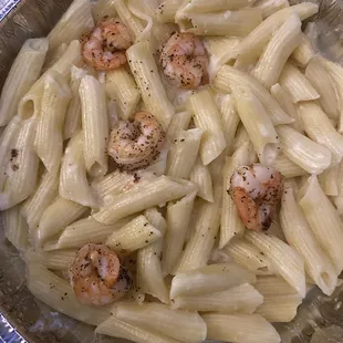 The Alfredo penne pasta with shrimp comes with the 5 tiny pieces you see. And if you&apos;re wondering where the sauce is, that makes two of us.