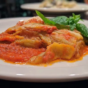 Mamma Edia&apos;s Eggplant. Sliced baked eggplant with classic tomato sauce and Parmigiano Reggiano. $9.85.