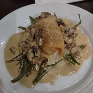 Crab Stuffed Filet of Sole in a Mixed Mushroom Sauce