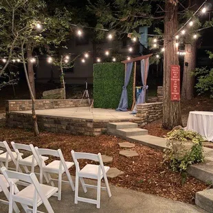 Backdrop, chairs, table covers and tables.