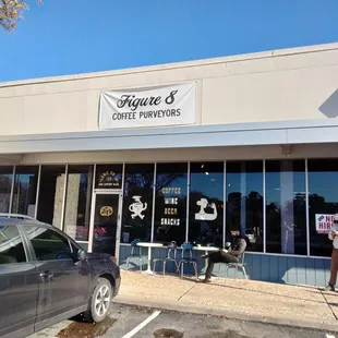 a car parked in front of a restaurant