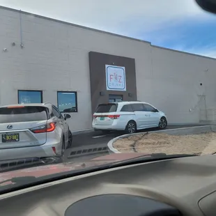 two cars parked in front of a building