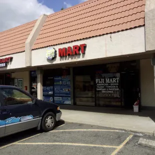 a car parked in front of the store