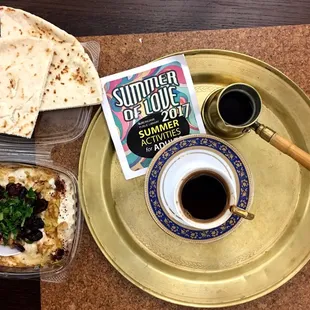 a plate of food and a cup of coffee