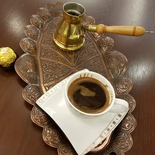 a cup of coffee on a tray