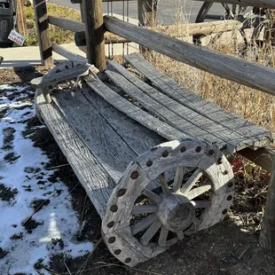 an old wagon wheel bench