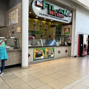 a woman standing in front of the counter