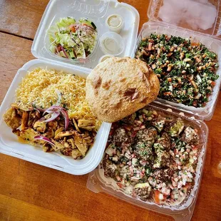 Tabbouleh, Falafel Salad, Chicken Shawarma. The bread &amp; greek salad were just bonus items. Bread was super soft too!