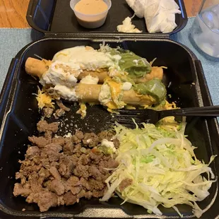 Partly eaten 5 rolled tacos and carne asada. Comes with sour cream and quac on the rolled tacos.