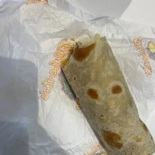 a burrito wrapped in paper