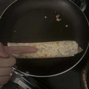 Note the comparison to my finger, and I had to heat it up myself since the cook doesn't understand how hot food should be.