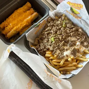 a tray of fries and a cheeseburger