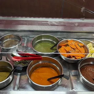 Salsa Bar galore, all excellent, roasted jalapenos and fresh pickled carrots,+ lemons go super with the Adobada!