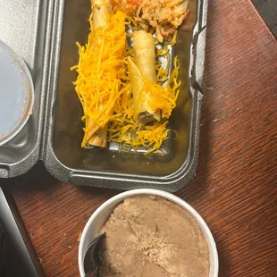 3 rolled tacos with cheese, () crusty refried beans.  ABSOLUTELY LIVID AND REVOLTED!
