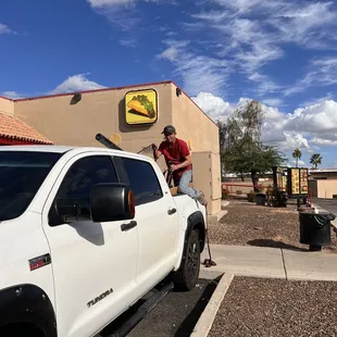 a man washing his truck