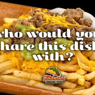 a plate of fries with cheese and meat